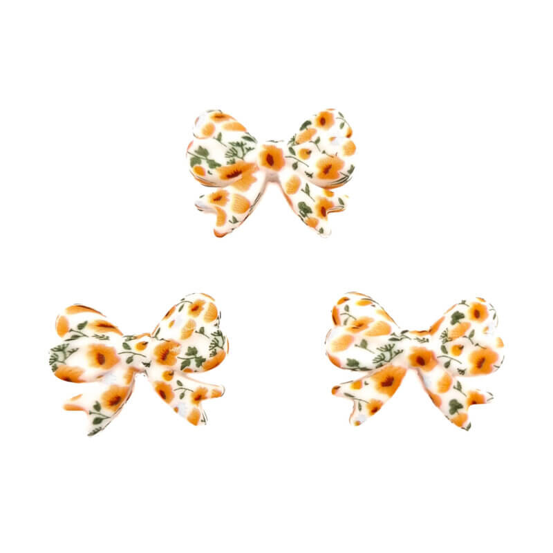 Silikonperlen - Schleife - Vertikales Fädelloch - Butterblumenaufdruck