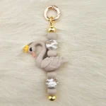 DIY Sleutel / Telefoonhanger - Zwaantje - Taupe
